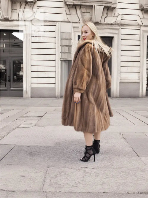 Brown mink fur coat from back/side, flared hem and soft fur collar