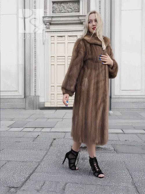 Brown mink fur coat with hood, front view, long sleeves, midi length, side pose.