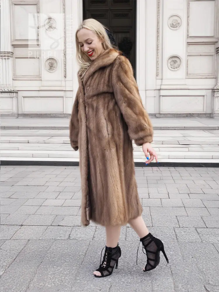 Brown mink fur coat with hood, side front view, long sleeves, midi length.