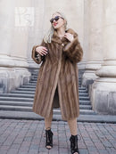 Brown mink fur coat with hood, long sleeves, straight mid-calf shape, front button closure