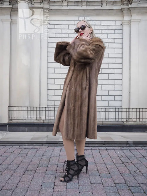Brown mink fur coat with hood, long sleeves, relaxed straight silhouette, side view