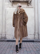 Vintage mink fur coat with hood, brown long length, standing side pose