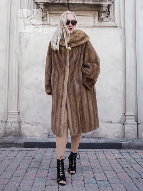 Vintage mink fur coat with hood, brown long length, standing side pose