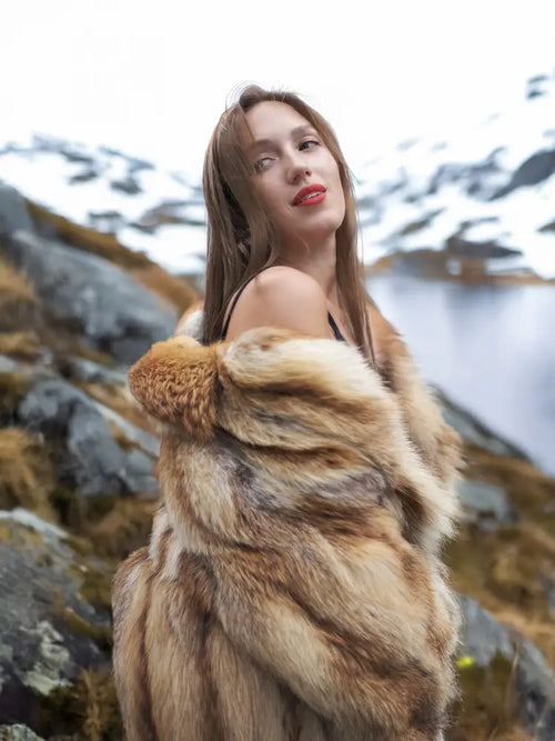 Hooded fur coat collar detail with tan-and-brown striped texture, front open.