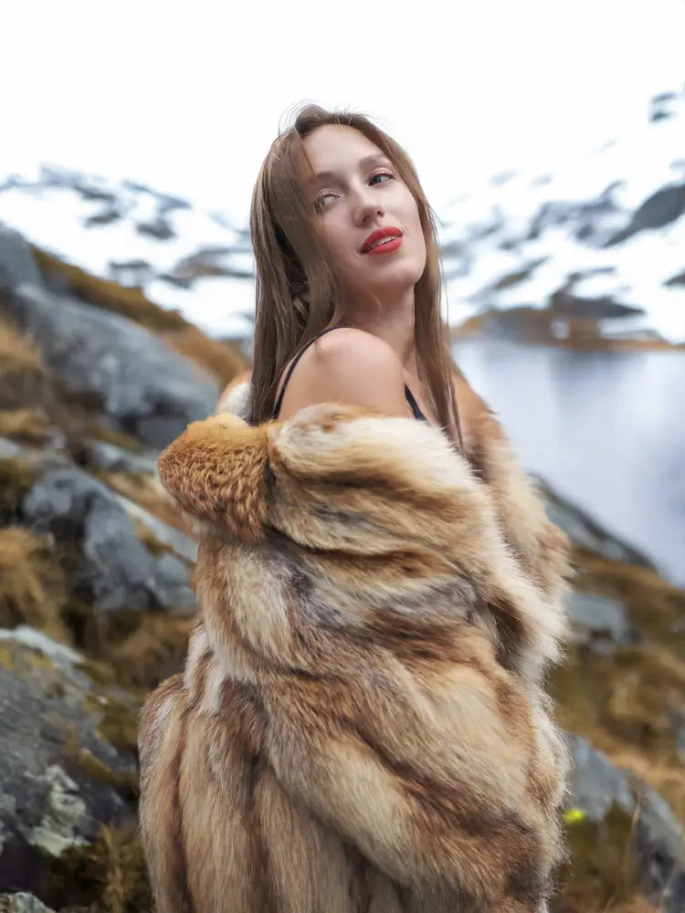 Hooded fur coat collar detail with tan-and-brown striped texture, front open.