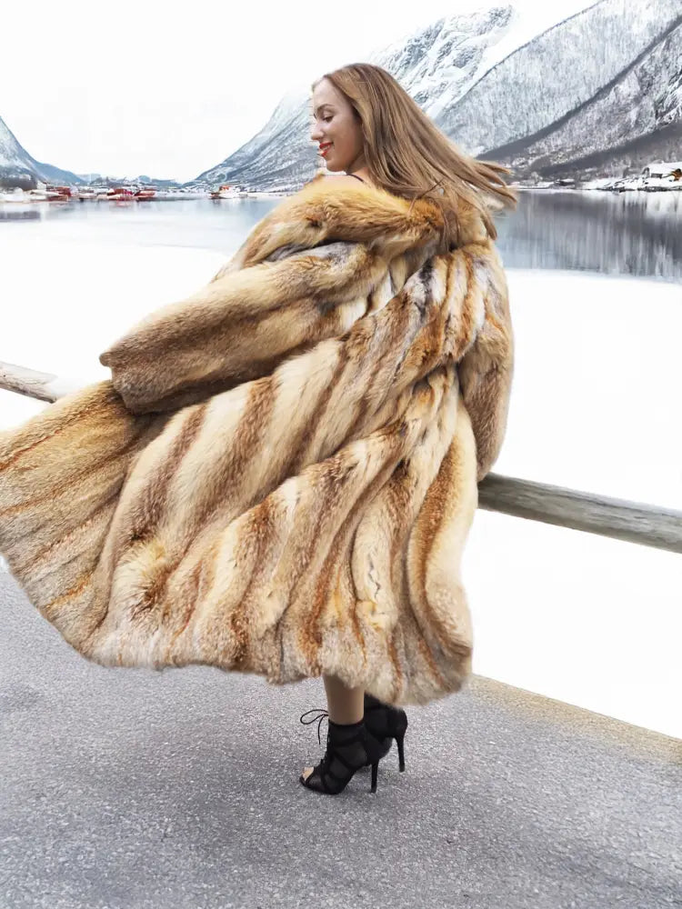 Long tan fur coat with open front; side view showing wide, flowing sleeves.