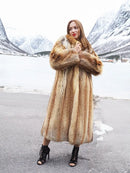 Long hooded fur coat in tan and brown with open front, belted look, thigh slit.