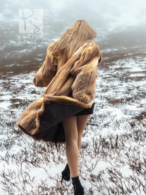 Fox fur coat in side view, draped shoulders and open black panel