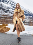 Tan fur coat with open front and long sleeves, walking pose with hem showing.