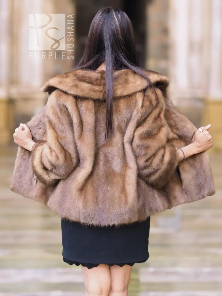 Beige mink fur opera jacket back view, voluminous fur with shawl collar.