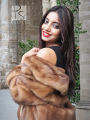 Beige mink fur opera jacket sleeve and shoulder wrap, plush scalloped collar detail.