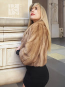Pastel beige mink fur opera jacket, side view with plush sleeves and collar