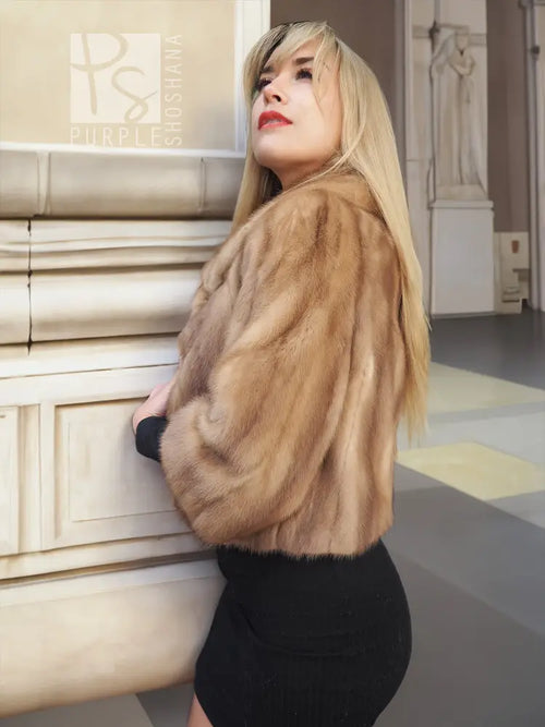 Pastel beige mink fur opera jacket, side view with plush sleeves and collar