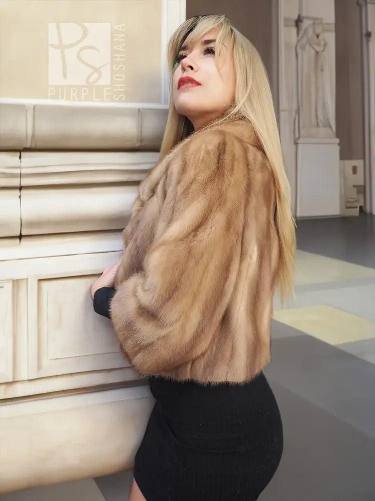 Pastel beige mink fur opera jacket, side view with plush sleeves and collar