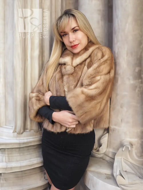 Pastel beige mink fur opera jacket with black cuffs and rounded fur neckline
