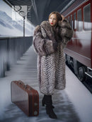 Gray fox-fantasy fur coat with oversized collar, worn with black boots and dress