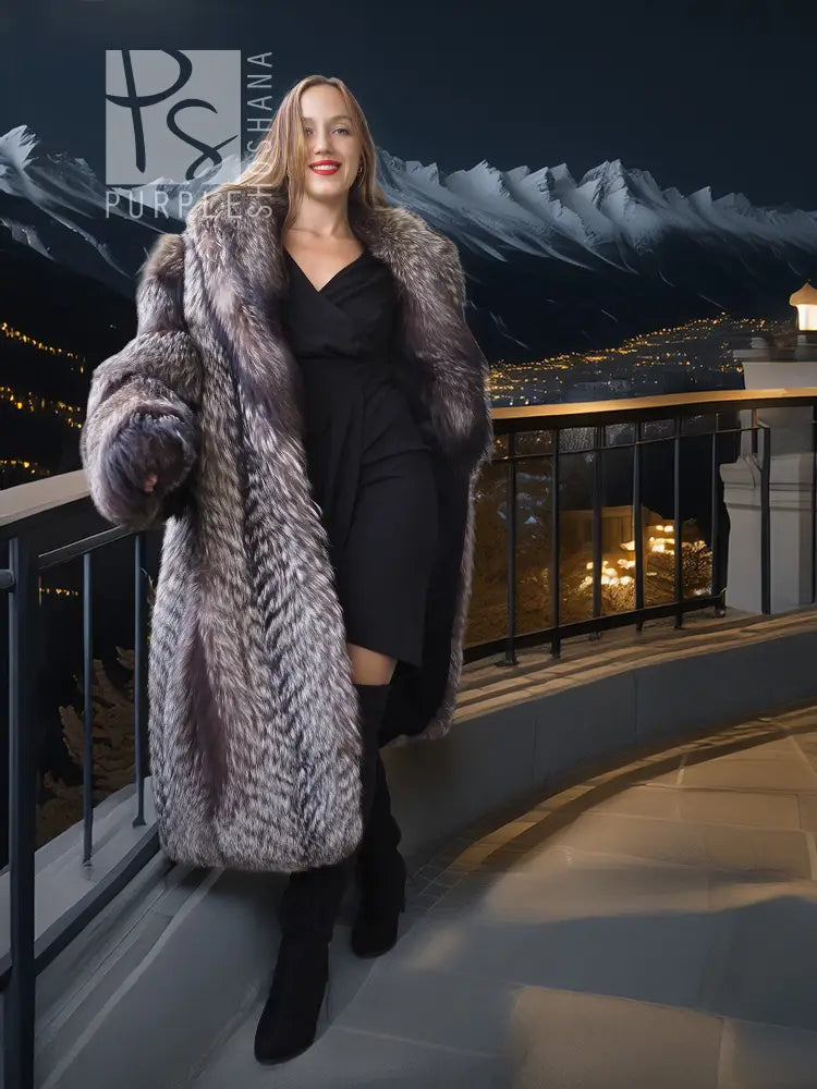 Silver-gray faux fur long coat with wide collar over a black dress and boots