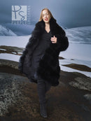Black fox fur shawl-collar coat, full-length with layered ruffled panels.