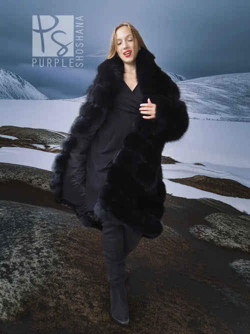 Black fox fur shawl-collar coat, full-length with layered ruffled panels.