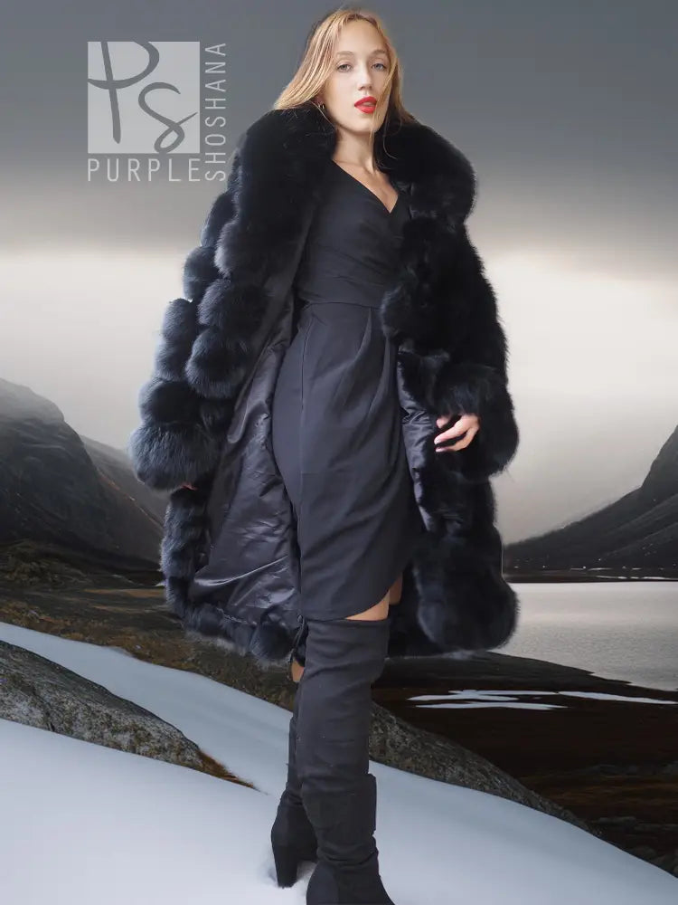 Black fox fur coat with shawl collar, long fur sleeves, model full-length stance.