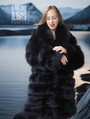 Black fox fur coat with shawl collar and tiered panels, side view