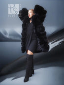 Black fox fur coat with shawl collar, long sleeves, open front, dramatic wide shoulder fur