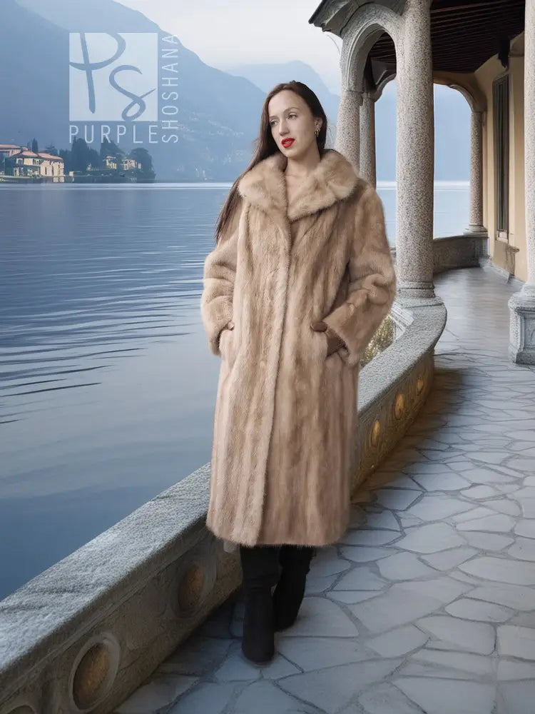 Beige full-length mink coat with wide fur collar and curved hem detail