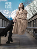 Light beige mink fur coat with open front, draped sleeves, and plush collar