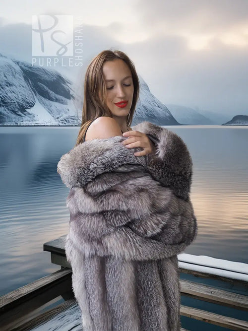 Long gray fur coat with shawl collar and open front, sleeves folded at chest