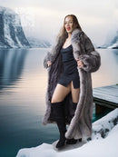 Long gray faux-fur coat with textured sleeves and draped lapels over black outfit