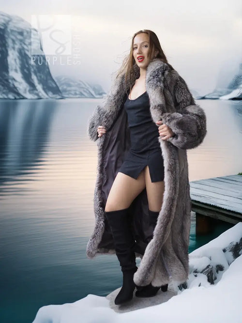 Long gray faux-fur coat with textured sleeves and draped lapels over black outfit