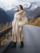 Long tan faux fur coat with shawl collar, side view showing relaxed fit and front pockets