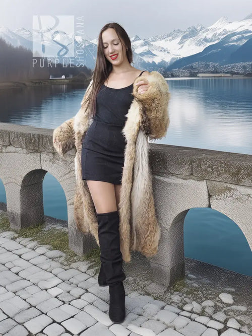 Tan faux fur coat with shawl collar and textured sleeves, standing pose beside stone walkway