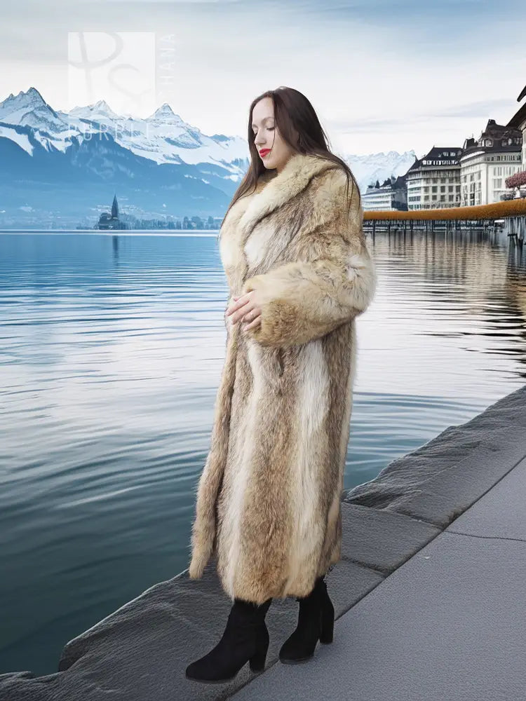 Tan faux fur coat with shawl collar from the side, long hem and open front visible